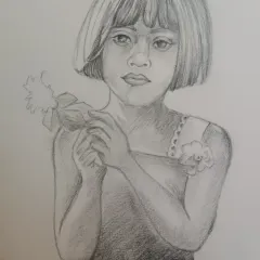 A beautiful example of a student's work in pencil sketching. This portrait of a young girl shows a good understanding of facial proportions and soft shading techniques, which we practice in my drawing classes for kids.