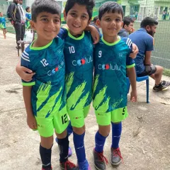 Friends and teammates. Three of our U9 players in their vibrant Coolulu kits, ready for their KSFA youth league match.