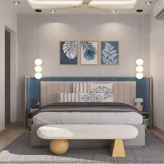 A wider view of the modern bedroom, showing the full headboard wall and the false ceiling detail. The combination of blue and beige tones creates a serene and restful environment.