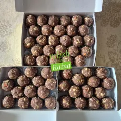My gluten-free Ragi Laddoos, a superfood treat. I combine ragi flour with pure ghee, almonds, walnuts, cashews, pumpkin seeds, dink (gond), and dates, making them incredibly healthy and delicious.