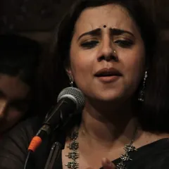 The expression on an artist's face tells the story of the raga. Here, guest artist Smt. Tanushree Kashyap Sharma is completely immersed in her vocal recital at our academy, demonstrating the profound connection between emotion and melody.