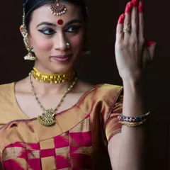 This portrait captures the essence of Bharatanatyam, my foundation as an artist. The precise hand gesture, or mudra, and focused expression are elements I bring into my modeling to convey specific emotions and narratives without words.