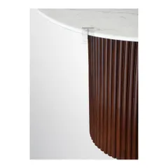 A detail of our classic fluted dining table, showing the rich texture of the wooden base and the smooth, elegant marble top.