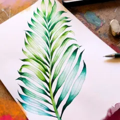 A demonstration of watercolor techniques on a palm leaf. Our "Pay as you like" workshops are a great, low-pressure way to try a new medium.