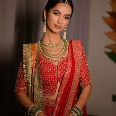 This portrait captures the complete bridal makeup look with the jewelry and outfit. The makeup is designed to enhance the bride's natural beauty while being bold enough to look stunning in wedding photos.