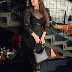 Another angle of the black dress, highlighting the puff sleeves and cutout details. Every element of an outfit contributes to the story you tell.