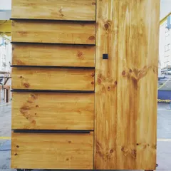 The final project of our diploma students: a mobile storage cabinet featuring solid pine drawer fronts and door, showcasing skills in both solid wood and panel processing.