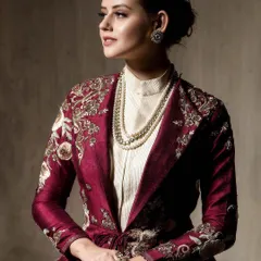 A more serene portrait from the same series, this seated pose gives a different feel. It highlights the detailed embroidery on the sleeves and the elegant layering with the pearl necklace.