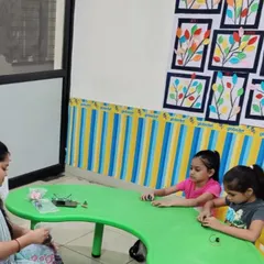 Here I am guiding two young learners at a workshop. I provide individual attention to make sure every child understands the concepts and can successfully build their project.
