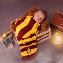 For a classic newborn look with a magical twist, I pose sleeping babies in this cozy Harry Potter theme. This shot captures the peacefulness of your newborn while celebrating a story you love, using soft wraps and safe posing techniques.