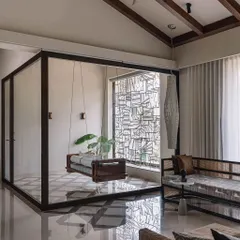This is not just a window grill; it's an autonomous functional installation. The abstract metal grid provides security while creating a stunning visual filter for the light, casting complex patterns that change throughout the day.