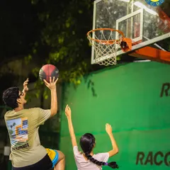 Two players practice their shooting and rebounding form. Our court is a great space for pairs to work on their game together, pushing each other to improve.
