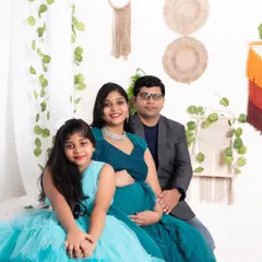 A beautiful family maternity portrait. We have matching outfits for kids too, like this lovely blue dress that coordinates with the mother's gown.