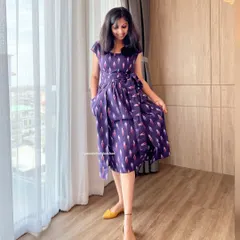 I designed this purple Ikat pinafore dress for a chic and comfortable fit. The side tie adds a lovely detail, and the pure handloom fabric feels wonderful against the skin.