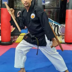 This is a ready stance with the Tonfa, another core weapon in the Jinbukan Kobudo system. My classes cover the practical application and traditional kata associated with these effective self defense tools.
