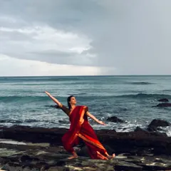 Feeling a sense of oneness with the universe while dancing on the rocky shores of Reunion Island. This image captures the spiritual connection between my art and nature.