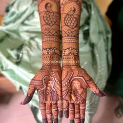 A classic bride and groom portrait, capturing their love forever in henna. I focus on getting the expressions just right, surrounded by beautiful traditional motifs like peacocks and detailed jaal work that extends up the arms for a full, regal look.
