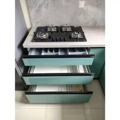 Organization is key. These drawers below the hob are fitted with custom cutlery trays and plate racks, keeping everything neatly in its place and within easy reach while cooking.