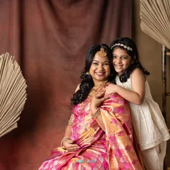 Two generations of beauty! This mom-to-be and her daughter look so lovely together in their traditional outfits. It’s a wonderful way to include the older sibling in the maternity celebration.