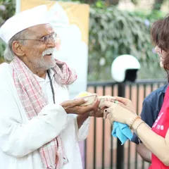 A moment of shared joy and connection during our Annadan food service. It is a blessing to serve our community with healthy, Sattvik meals.