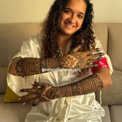 The smile of a happy bride is my greatest achievement. It was a joy to create this full-arm, detailed mehendi for her, ensuring every line was balanced and the final look was as timeless as her celebration.