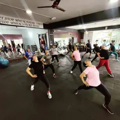 The concentration and energy during a stretching part of our aerobics class. Flexibility is just as important as strength.