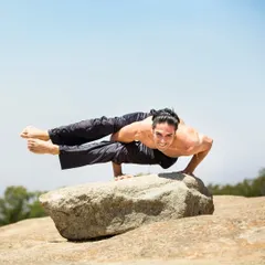 Taking the practice outdoors, a student holds a powerful arm balance, Eka Pada Koundinyasana II. This pose requires immense core strength, balance, and focus, all of which we cultivate in the TTC.