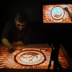 This shot captures me at work on the Eastern Naval Command crest, with the live projection visible on the monitor. It shows the live performance setup for these high-stakes events, where precision and emotion must come together seamlessly.