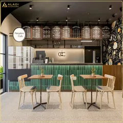 The main service counter of the Mangalore Cafe concept, featuring a back-lit green tiled front, a clear menu board system, and an efficient workflow layout.