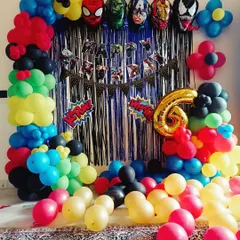 A full-room superhero theme decoration. I used character foil balloons, a 'Happy Birthday' banner, and balloon columns to create an exciting party atmosphere for a 6th birthday.