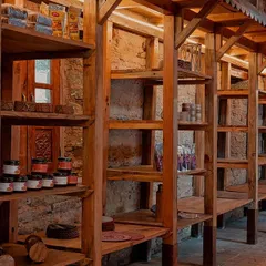 This detail of the custom shelving at the Sargakhet Handicraft Centre shows how we used simple, locally sourced wood to create a functional and beautiful display system. The design respects the rustic charm of the building while providing a platform for local artisans to sell their goods.