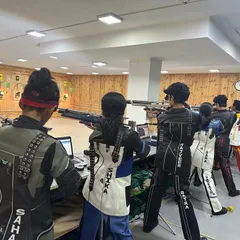A view of my high-performance center during a training session. Shooters are geared up in professional kits, using our advanced electronic targets to hone their skills for upcoming rifle and pistol competitions.