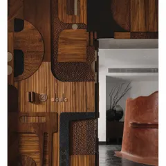 This custom door is a collage of different wood textures, grains, and finishes. It is a celebration of material and craftsmanship, turning a simple entryway into a complex, tactile piece of art that tells a story of its own making.