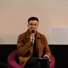 A young poet sharing his work during the 'Verse & Voice' showcase. Our workshops are designed to build the confidence needed to command the stage.
