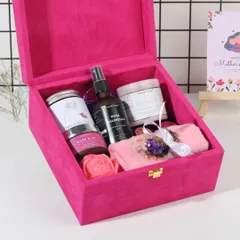 An inside look at the pink velvet Mother's Day box. You can see the Rose Velvet body butter, Rose Clay mask, and other handmade items ready to be discovered.