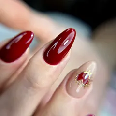 A close-up of the cherry red set, highlighting the glossy finish and the intricate detail on the heart accent nail. This shows my attention to detail even in simpler designs.