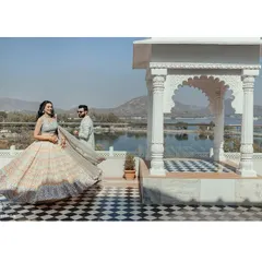 A beautiful, twirling shot of Radhika at her Udaipur pre wedding event. The stunning architecture and lakeside view of the Radisson Blu provide a perfect royal backdrop.