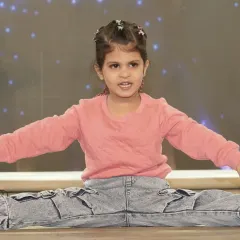 Even our youngest students learn about performance and stage presence. This little star is showing off her flexibility and confidence during her first showcase.