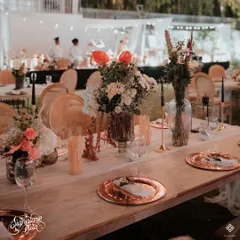 A detailed look at the anniversary tablescape. I used rose gold charger plates, delicate floral arrangements, and black taper candles to create a look that was both modern and timelessly romantic.