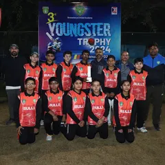 The DCA Bulls team, runners-up of the Youngster Trophy, pose with their coaches. Their journey through the tournament was marked by great skill and fighting spirit.