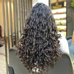 Here is the result after a proper curly haircut and deep conditioning. Notice how the curls clump together, are more defined, and have a healthy shine. This is what understanding your hair can do.
