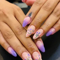 A closer look at the detail in our floral ombre nails. You can see the fine brushstrokes in the tiny petals and leaves, showcasing the skill that goes into each custom, hand-painted design.