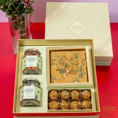 This is where tradition meets modern elegance. My premium gift hampers, like this one featuring artisanal mithai, laddoos, and savory nuts, are thoughtfully curated and beautifully packaged to make your festive gifting truly special.