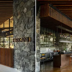 The entrance to the restaurant and the bar area at the Radisson Resort are defined by heavy stone pillars and rich wooden details, grounding the modern design in the region's material history.