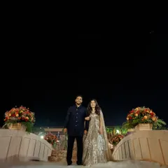 Romance built on history. For this 'Lost City' themed event, I constructed a grand Roman bridge over a water body, providing a dramatic and unforgettable setting for the couple's ring ceremony, surrounded by mist and ancient wonder.