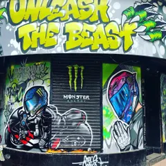 This is a full-frontal look at the storefront I transformed for the Performance Racing store, a project in collaboration with Monster Energy. I used my signature graffiti style to create an unmissable facade with the "Unleash The Beast" tagline, giving the shop serious street cred.