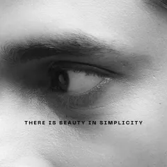 A minimalist black and white close-up of an eye. This fine art shot uses simplicity and text to convey a message, focusing on the beauty in simple forms.