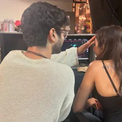 A quiet moment on the set of the music video 'Razdariyan'. As a costume stylist, a lot of my job is watching the monitor to ensure every detail of the wardrobe looks perfect on camera and supports the story.