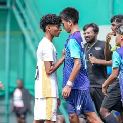 The heat of competition. An intense face-off between our player and an opponent, showcasing the passion and fight we bring to every game.