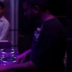 Here you can see me working the mixer in a low-light club setting. I'll teach you how to navigate your equipment flawlessly, even in the most demanding live environments.